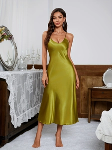 Detailed view of olive green satin slip dress with V-neckline and smooth silk texture