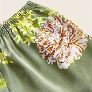 Silk-like satin women's pajama shorts with floral print and elastic waist detail