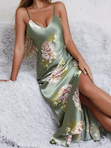 Detail of green floral satin nightgown showing high side slit and silky texture