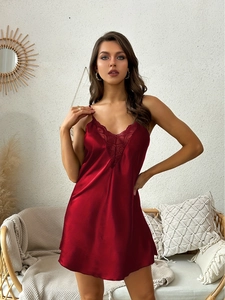 Detail of burgundy satin nightgown showing the exquisite V-neck lace trim and silky fabric