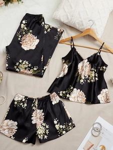 Three-piece black satin sleepwear set with beige floral print and silk-like finish