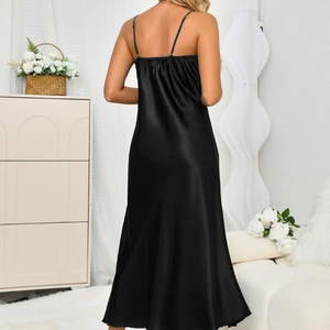 Elegant black satin slip dress with a backless design and thin straps for a sleek look