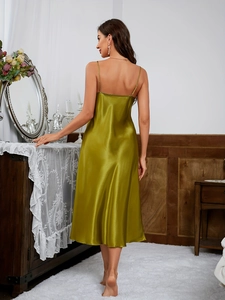 Detail of olive green satin nightgown showing the thin adjustable straps and low back design
