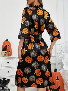 Detailed back view of Halloween pumpkin print satin bathrobe with kimono sleeves