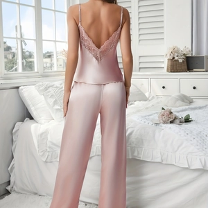 Elegant pink silk pajama set for women with lace trim camisole and wide-leg pants