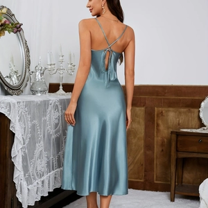 Elegant light blue satin slip dress featuring cross back straps and backless design