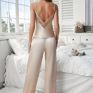 Elegant champagne satin pajama set for women with delicate lace trim on the open back