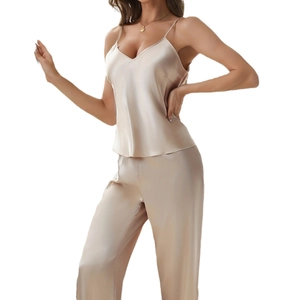 Elegant champagne silk pajama set for women with V-neck lace top and matching long pants