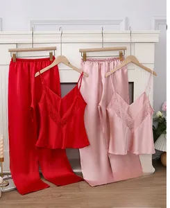 Detailed view of silk pajama sets with lace trim in wine red and soft pink colors