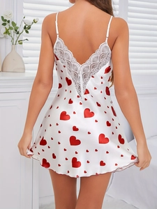 Lace detail on back of white satin nightgown with red heart print and thin straps