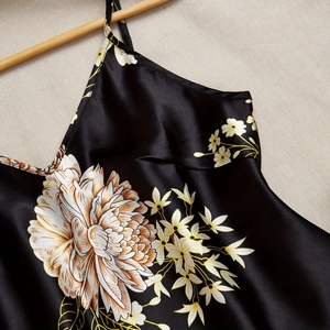 Elegant black silk floral slip dress with adjustable straps and satin finish style
