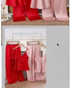 Detailed view of silk-satin pajamas with lace V-neckline and smooth fabric texture