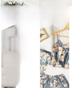 Detail of grey-blue satin pajama set featuring orange floral prints on silk-like fabric