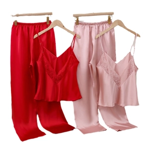 Women's silk satin pajama set with V-neck lace trim and spaghetti straps in red and pink