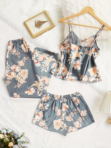 Detailed view of the 3-piece floral satin pajama set showing the soft silky texture