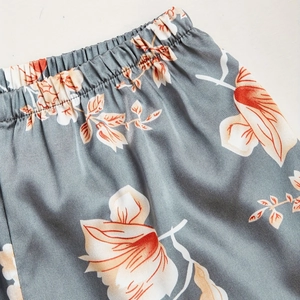 Three-piece floral satin sleepwear set with elastic waistband and orange flower prints