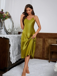 Close-up of grass green satin nightgown with elegant V-neck and delicate straps