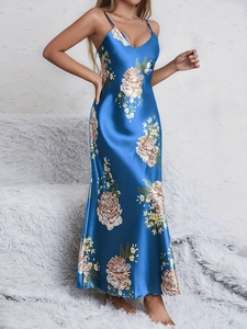 Detail of elegant navy blue floral satin nightgown with V-neck and spaghetti straps