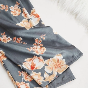 Three-piece satin pajama set with vintage floral print in deep blue and orange