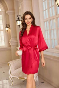 Detail view of a luxury red satin bathrobe for women with elegant V-neck and waist tie