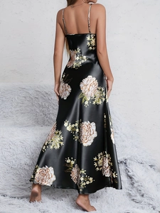 Detail of black satin floral nightgown showing a-line silhouette and silky texture back