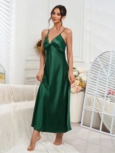 Detailed lace trim on V-neck of a dark green silk-like satin long chemise nightgown