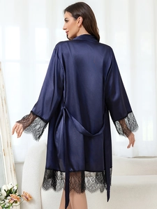 Rear view of navy blue satin robe with black eyelash lace trim and matching waist tie
