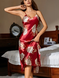 Detail view of red satin nightgown featuring vintage floral print and silk-like texture