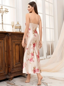 Detail of satin floral slip nightgown with thin straps and red rose print pattern