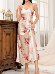 Detail of floral print silk strap nightgown with satin texture and elegant V-neck design