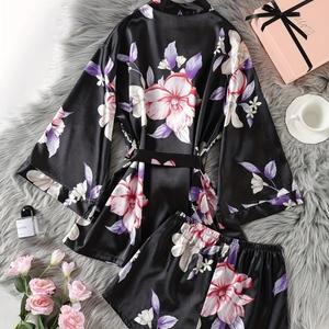 Black floral satin kimono robe set with shorts on a plush grey carpet background