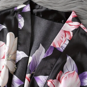 Black satin floral kimono robe with pink flower patterns and silk texture design
