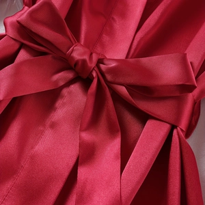 Women's red satin pajamas two-piece set featuring a detailed waist bow and silky fabric