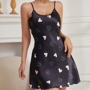 Elegant black satin slip dress with pink heart patterns and thin shoulder straps