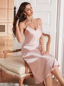 Close-up of pink satin slip dress featuring elegant V-neck and delicate straps