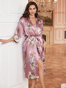 Detail of floral satin robe and nightgown set in lotus pink with silky texture