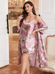 Detail of elegant dusty pink floral satin sleepwear set with soft silk texture and lace