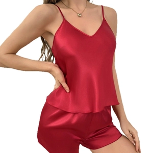 Women's burgundy satin pajama set featuring a V-neck camisole and matching shorts