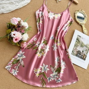 Elegant satin floral slip nightdress in pink with white lily patterns and smooth finish