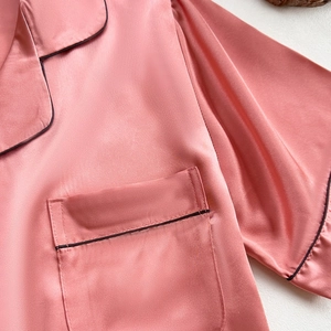 Lustrous pink faux silk pajama top with notched collar and contrast piping detail