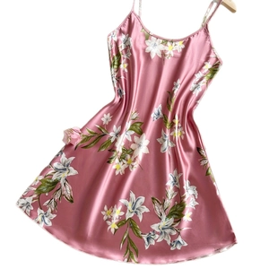Pink satin slip nightgown featuring white lily floral print and smooth silky texture