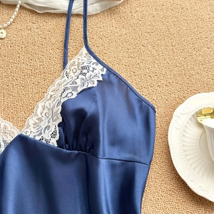 Navy blue silk pajamas set with white floral lace trim and delicate spaghetti straps