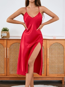Close-up of red satin long nightgown with sexy high side slit and silky texture