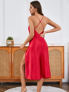 Detail of red satin nightgown featuring criss-cross back straps and deep open back