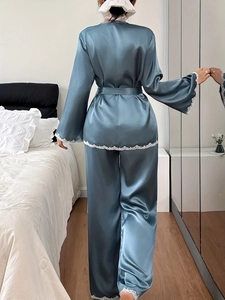 Detail of teal satin pajamas showing the lace trim on sleeves and back view of the robe