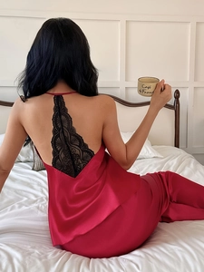 Detailed back view of wine red satin sleepwear with intricate black floral lace patchwork