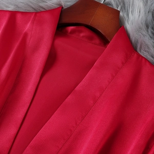 Luxurious red silk satin robe for women with elegant V-neck and smooth draping texture