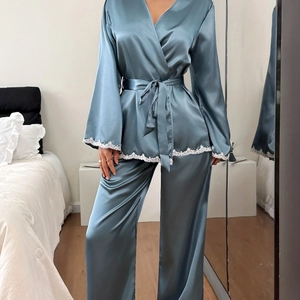 Elegant two-piece gray-blue satin pajama set with white lace trim and kimono wrap belt