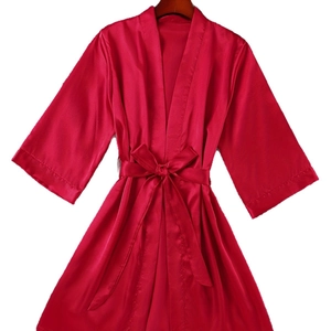 Elegant red silk robe with waist tie and long sleeves in a minimalist open-front design