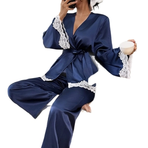 Navy blue silk-satin pajama set for women with white lace trim and kimono-style tie